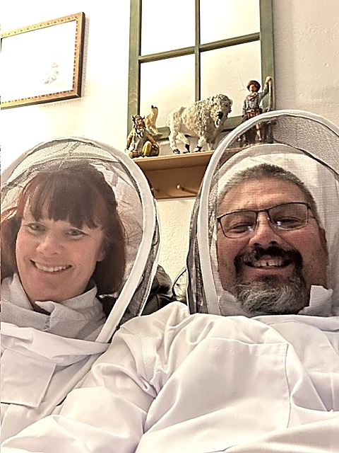 Lee and Cherie White suited up in beekeeping veils