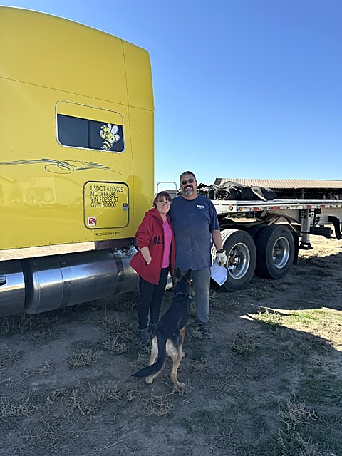 Lee and Cherie White with their bee-hauling truck