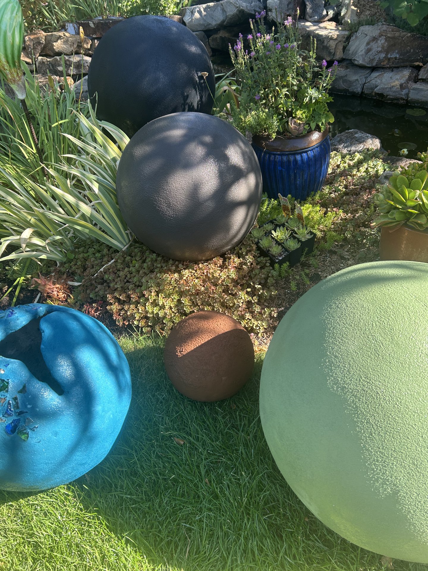 Handcrafted cement orbs — concrete art and planters